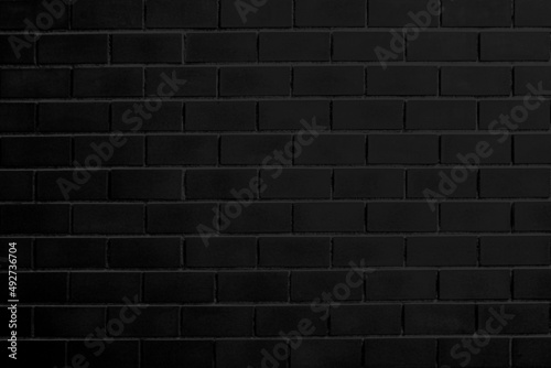 black brick wall background in old dark The interior walls were empty with light and shadows.