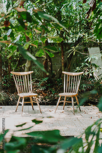 empty wood chair and table in garden