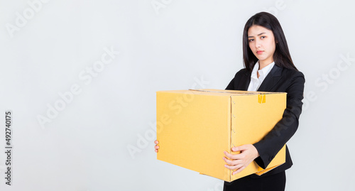 Business woman holding brown box, fired from her job. © HappyTime 17