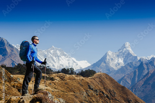 Peak Panoramic view on mountains hills Successfully achieving your goal, man on the mountain. Success Business Leadership, Winner Man on top. Business Sport and active life concept photo