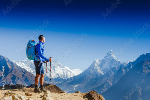 Successful man hiker on top of mountain