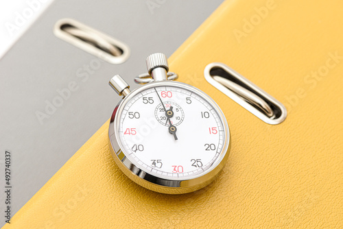 Yellow office folder on the chronometer.
