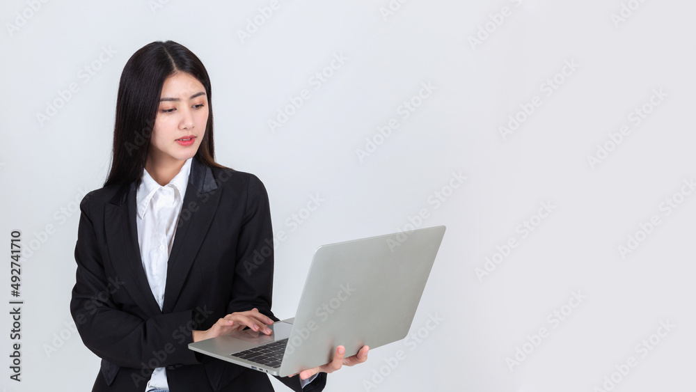 attractive business woman wearing office clothing successful hold computer laptop , Technology communication lifestyles concept. attractive business woman wearing office clothing successful hold computer laptop , Technology communication lifestyles concept.