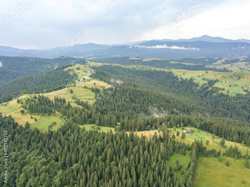 Green mountains of Ukrainian Carpathians in summer. Aerial drone view.
