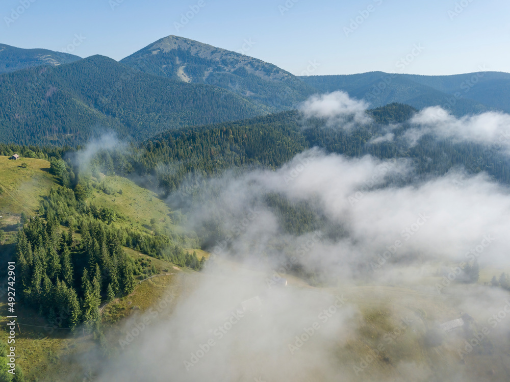 Morning fog in the Ukrainian Carpathians. Aerial drone view.