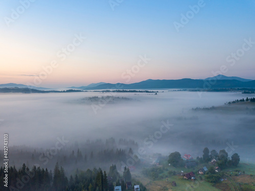 Morning fog in the Ukrainian Carpathians. Aerial drone view.