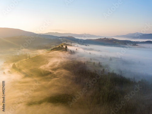 Morning fog in the Ukrainian Carpathians. Aerial drone view.