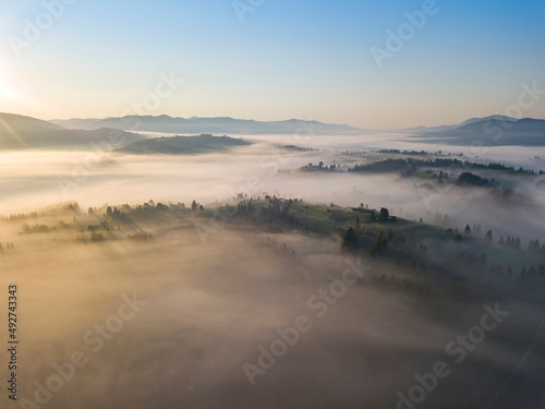 Morning fog in the Ukrainian Carpathians. Aerial drone view.