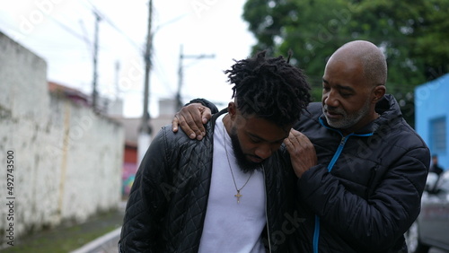 Father and son walking together bonding talk