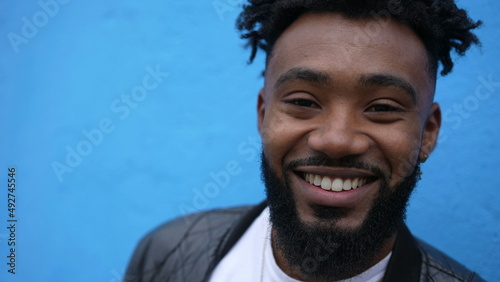 A happy young black man smiling portrait face one charismatic African person
