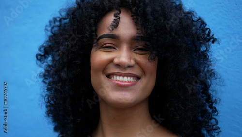 A happy latin African woman laughing and smiling