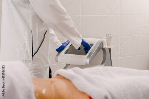 Closeup photo of woman getting body contouring procedure in beauty clinic