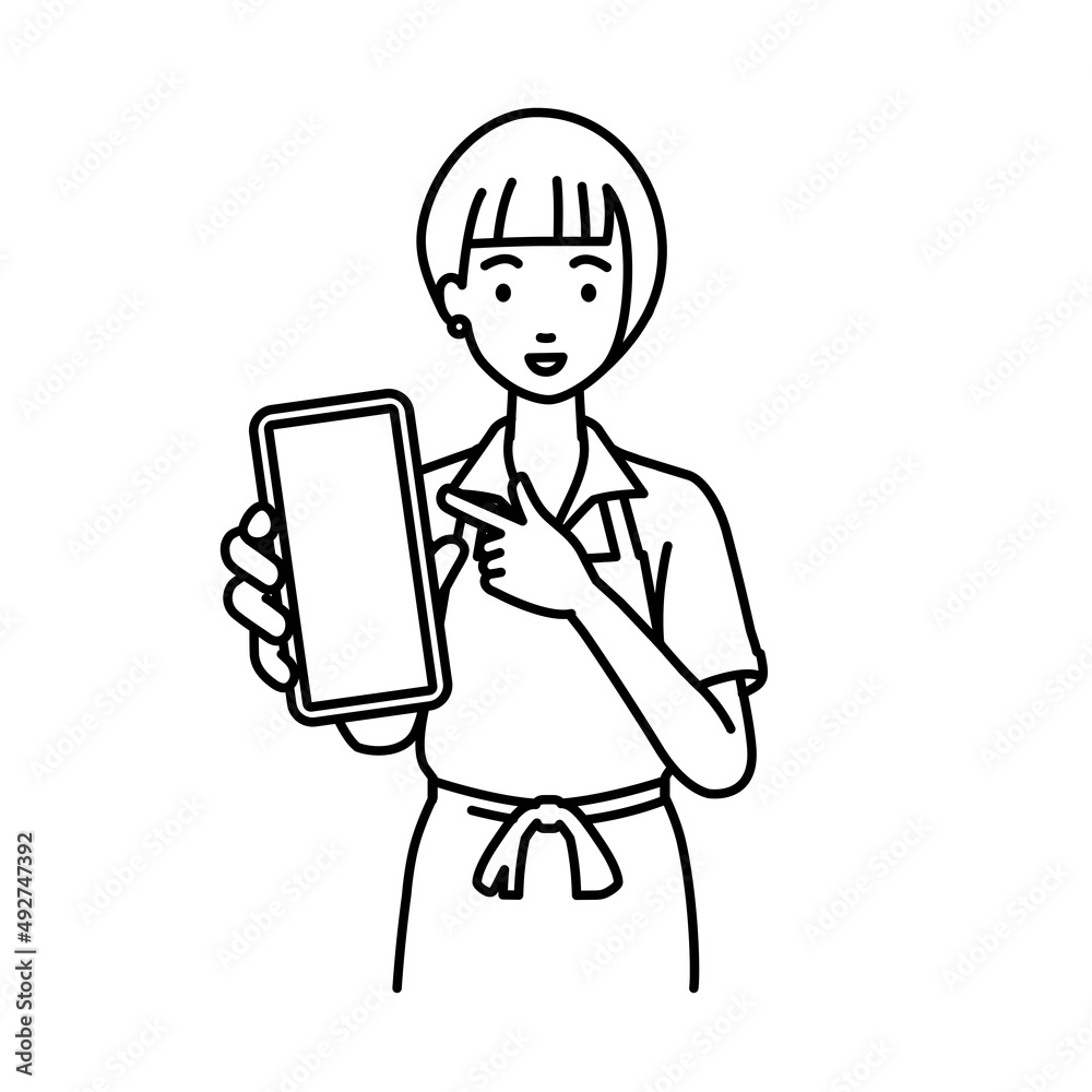 立ってスマートフォンを指差してこちらに向けて見せているエプロンをした店員の女性 立ってスマートフォンを指差してこちらに向けて見せているエプロンをした店員の女性
