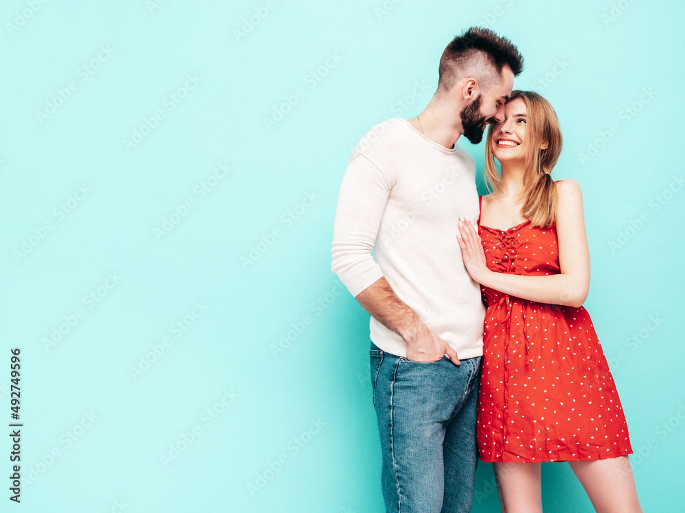Sexy smiling beautiful woman and her handsome boyfriend. Happy cheerful family having tender moments near blue wall in studio.Pure cheerful models hugging.Embracing each other. Cheerful and happy Sexy smiling beautiful woman and her handsome boyfriend. Happy cheerful family having tender moments near blue wall in studio.Pure cheerful models hugging.Embracing each other. Cheerful and happy