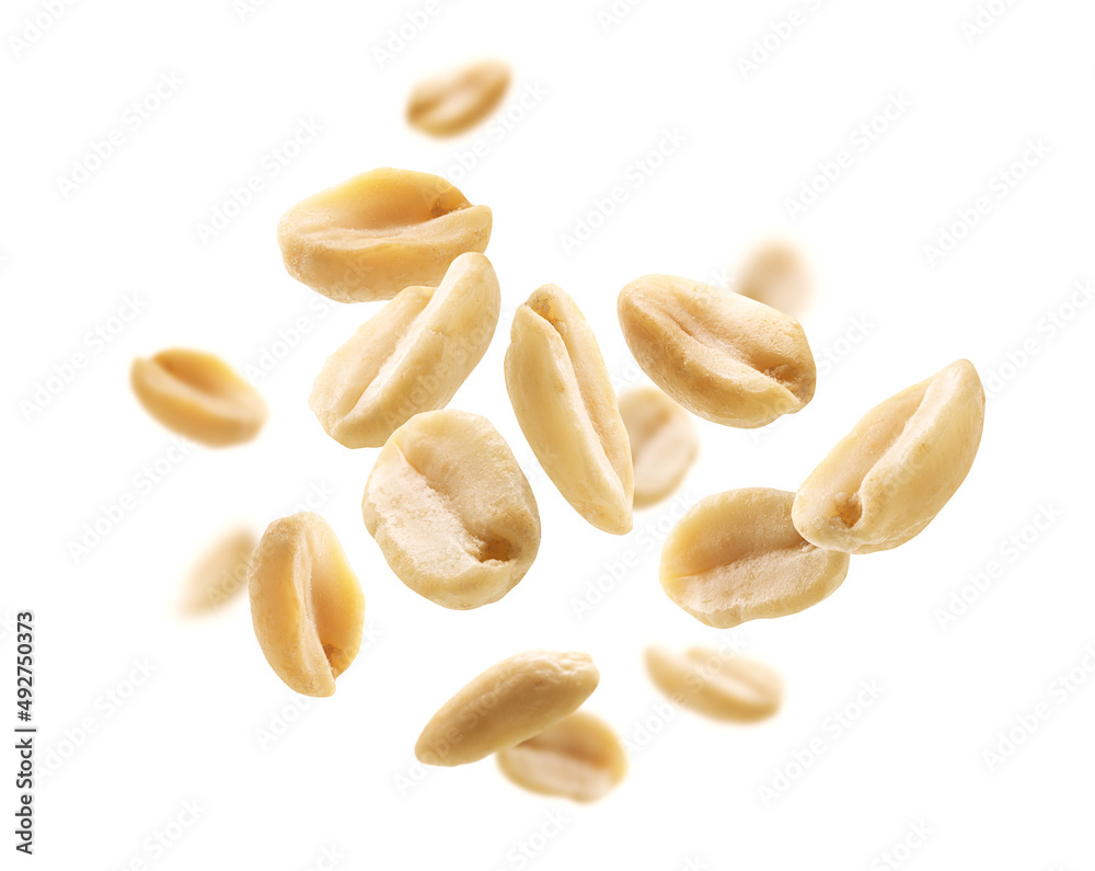 Peeled peanuts levitate on a white background Peeled peanuts levitate on a white background