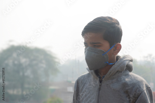 Boy wearing protection mask, India photo