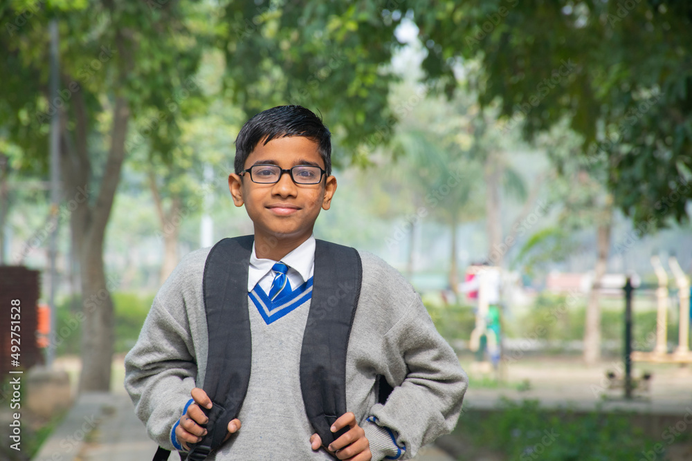 portrait of a student with a bag on his back portrait of a student with a bag on his back