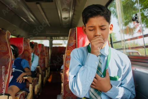  Boy Coughing In School Bus photo