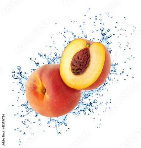 Whole and halved peaches in water splash with full depth of field isolated on white background.