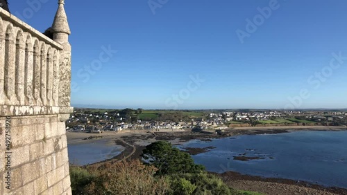 St Michael's Mount is a tidal island in Mount's Bay, Cornwall, England, United Kingdom. The island is a civil parish and is linked to the town of Marazion by a causeway of granite setts. photo