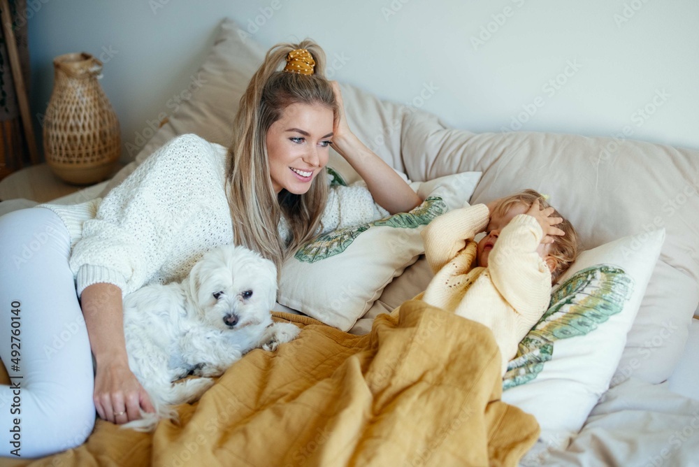 Young beautiful mother playing with baby daughter at home. Young beautiful mother playing with baby daughter at home.