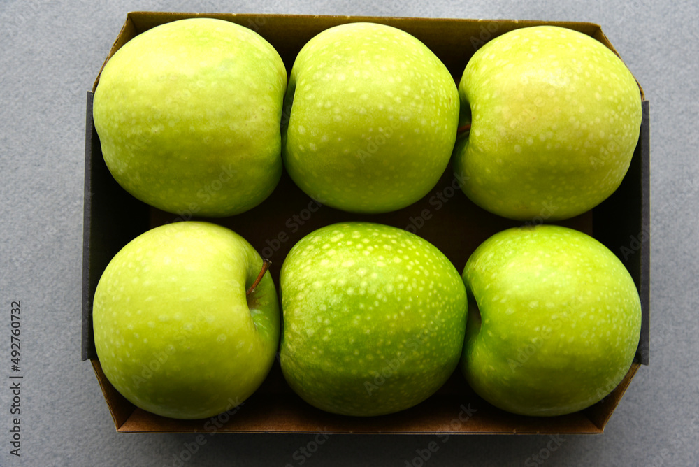 Green apples in the background close-up