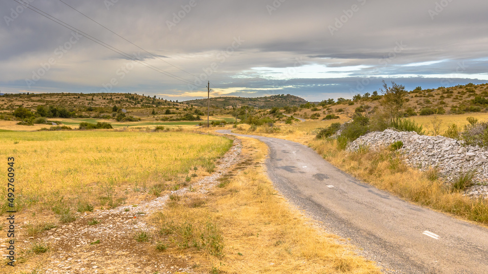 Sunrise over road in Causse Blandas