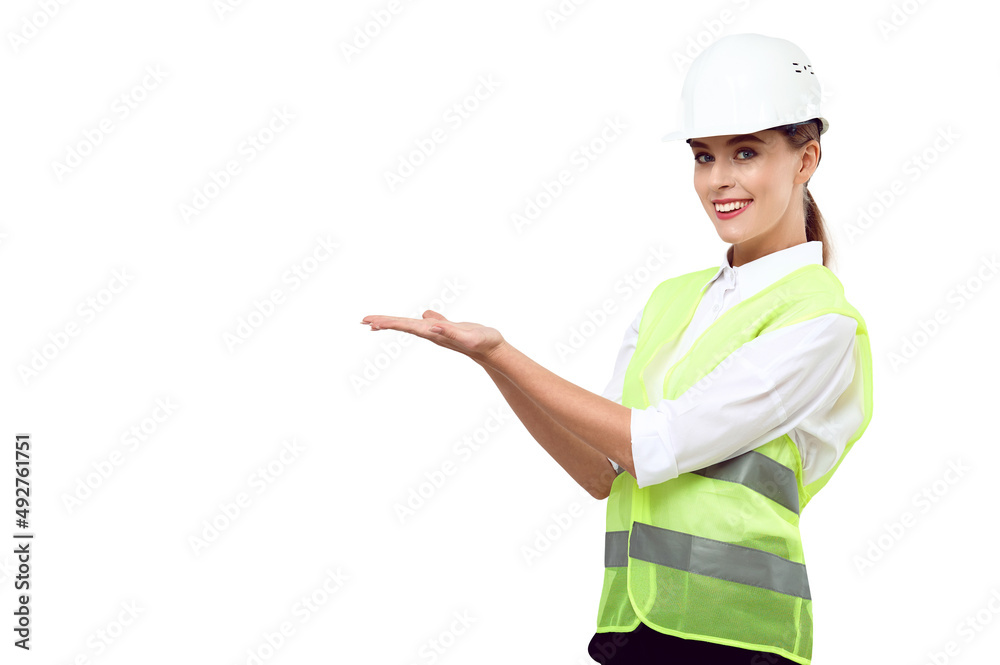 Young white caucasian woman engineer in a safety helmet green reflective vest holds an invisible advertising product on a white isolated background Young white caucasian woman engineer in a safety helmet green reflective vest holds an invisible advertising product on a white isolated background