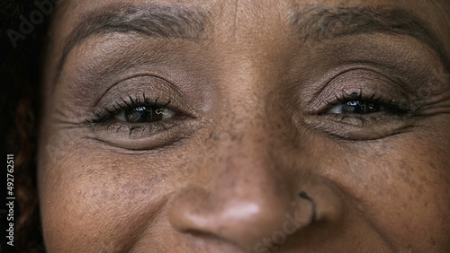 Macro close-up eyes person smiling a black woman happy expression
