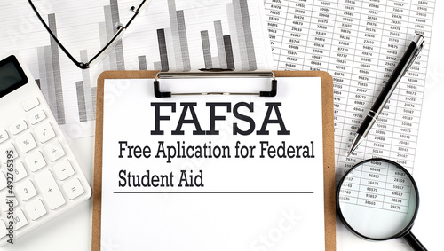 FAFSA. Free application for federal student aid. A text on clipboard on chart photo
