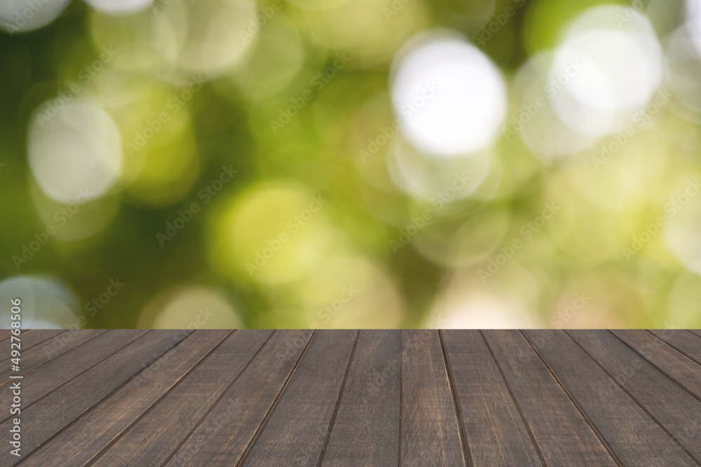 Empty wood table on bokeh nature background.For montage product display. Empty wood table on bokeh nature background.For montage product display.