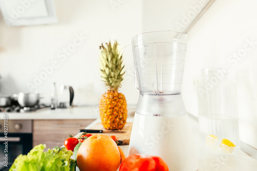 Fruits on the smoothie table. Breakfast of fresh fruits in a blender of peach, banana, apple. close-up. Healthy food.
