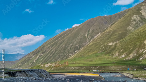 The Terek (Tergi) river flows down the Truso Valley near the Ketrisi Village Kazbegi District,Mtskheta in the Greater Caucasus Mountains,Georgia. Mineral springs, geyser, mineral lake photo