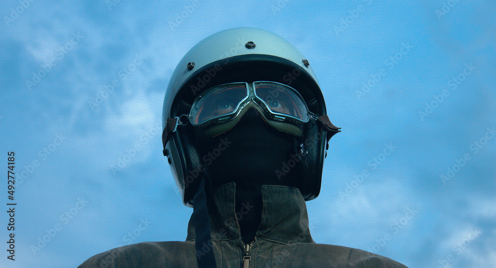 Fototapeta premium motorcyclist rides through a beautiful field