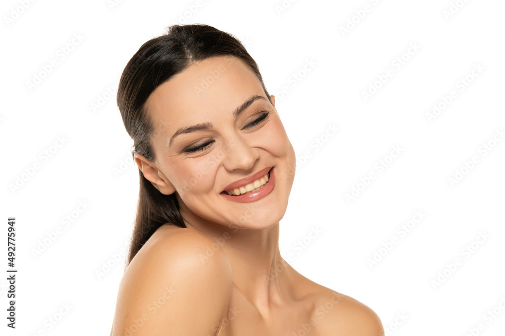 Beautiful shirtless happy woman with make up on a white Beautiful shirtless happy woman with make up on a white