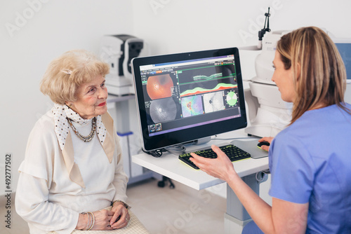 older woman has eye examination. digital retina scanner photo