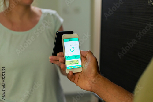 Close-up payment of food delivery with a smart phone