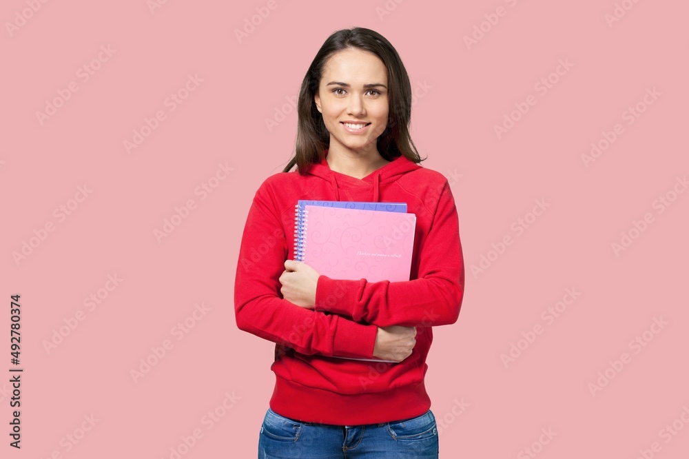 Smiling happy teen student girl hold books Smiling happy teen student girl hold books