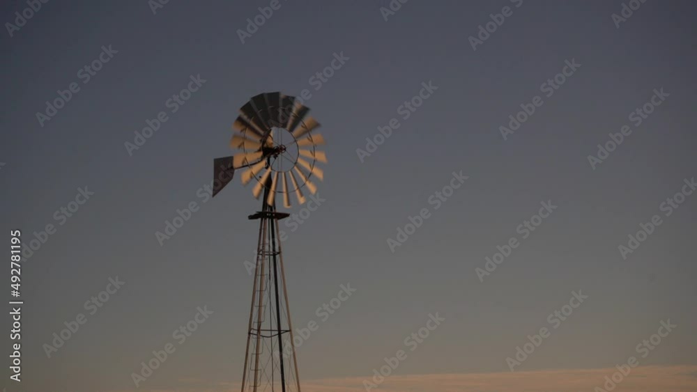 A ranch windmill against a clear blue sky A ranch windmill against a clear blue sky