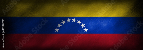 Free Download The flag of Venezuela on a grunge background - GFXLoad