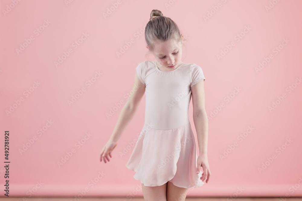 little dancer in pink tutu on pink background