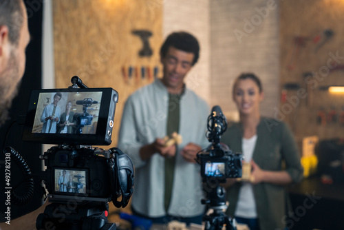 Two carpenters being filmed for the blog