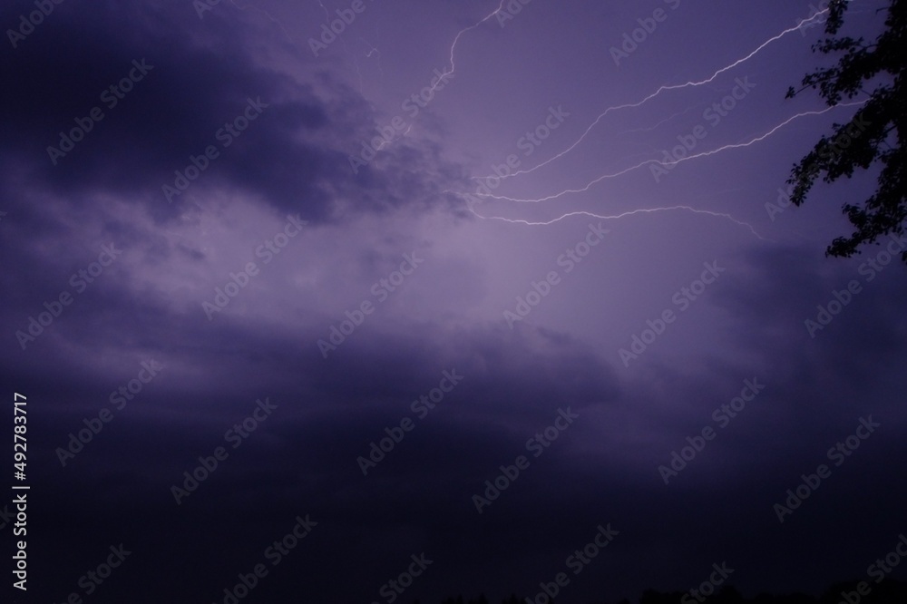 Dramatic landscape before rain, thunderstorm and lightning in dark sky with blue clouds Dramatic landscape before rain, thunderstorm and lightning in dark sky with blue clouds