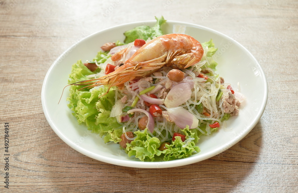glass noodle with shrimp and chop pork spicy salad on plate
