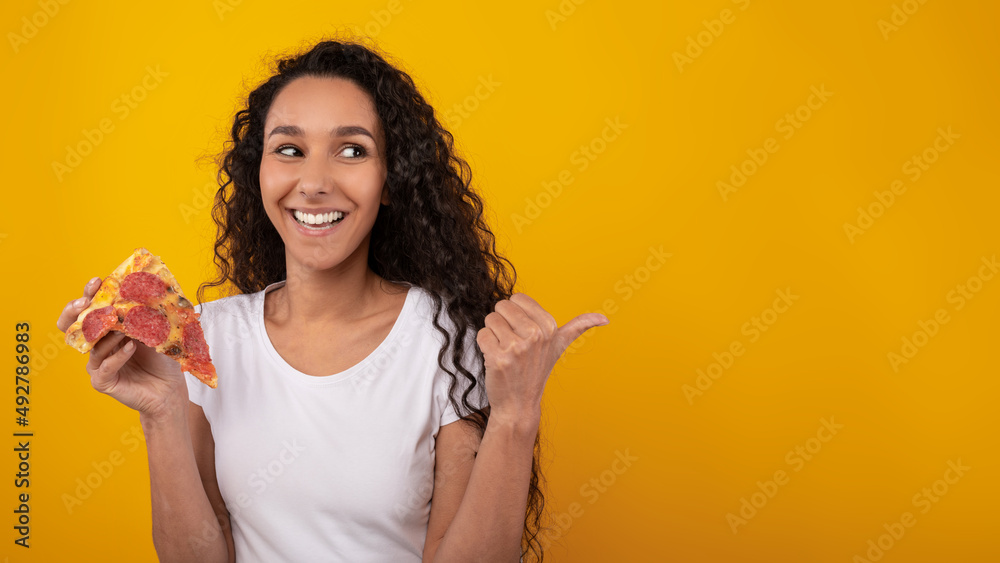 Portrait Of Happy Lady Holding Pizza And Pointing Away Portrait Of Happy Lady Holding Pizza And Pointing Away