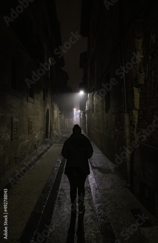 Woman in dark street