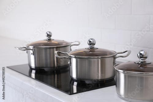 Set of new clean cookware in kitchen