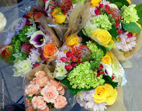 Colorful spring flower bouquets in grocery store.
