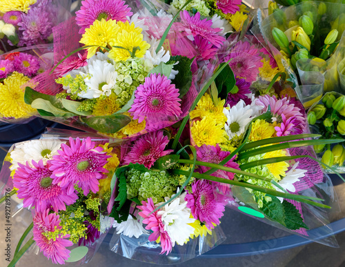 Colorful spring flower bouquets in grocery store.