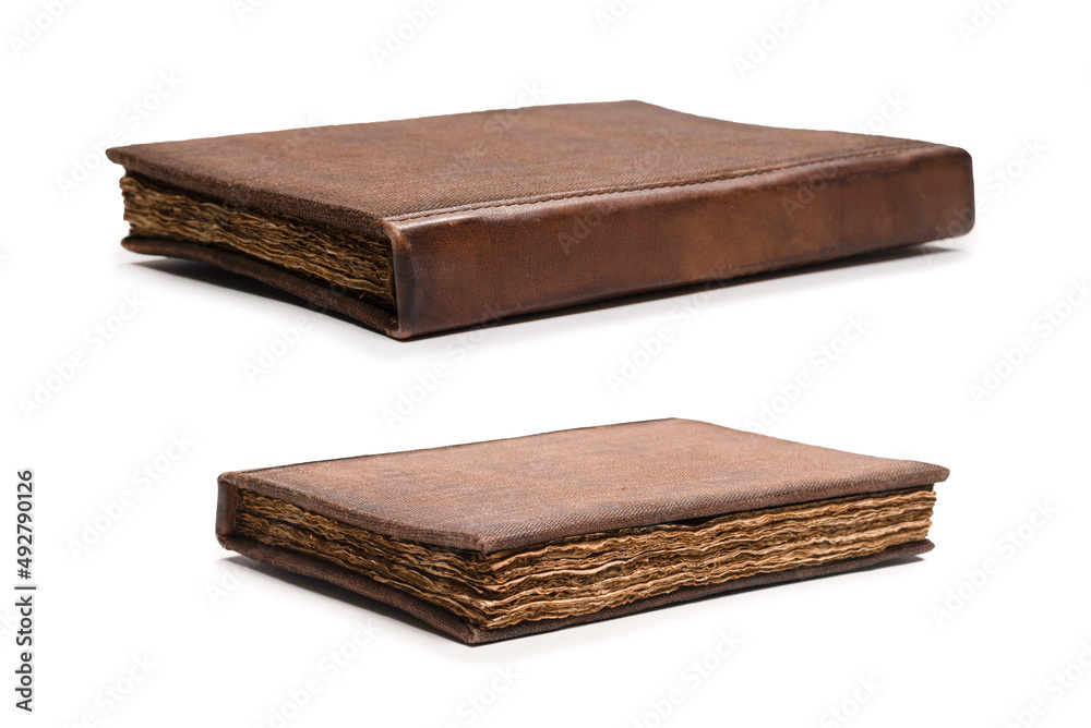 An old brown book isolated on white background. An old brown book isolated on white background.